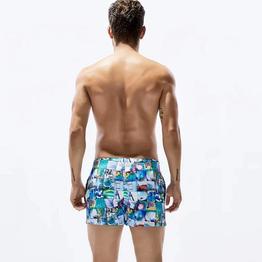 a hot gay man in blue Postcard Grid Board Shorts - pridevoyageshop.com - gay men’s underwear and swimwear
