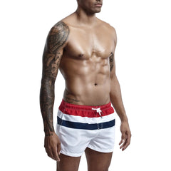 a hot gay man in Siren's Stripe Swim Trunks - pridevoyageshop.com - gay men’s underwear and swimwear