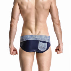 a hot gay man in navy blue Men's Wide Gray Band Swim Briefs - pridevoyageshop.com - gay men’s underwear and swimwear