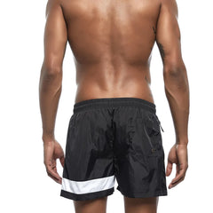 a hot gay man in black Reflex Racer Board Shorts - pridevoyageshop.com - gay men’s underwear and swimwear