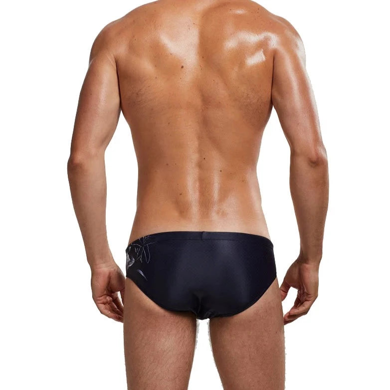 a sexy gay man in Men's Patterned Swim Briefs - pridevoyageshop.com - gay men’s underwear and swimwear