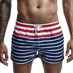 a hot gay man in Men's Sailor Striped Board Shorts - pridevoyageshop.com - gay men’s underwear and swimwear