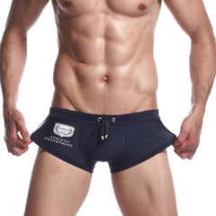 a sexy gay man in dark blue Men's Athletic Square Cut Swim Trunks - pridevoyageshop.com - gay men’s underwear and swimwear