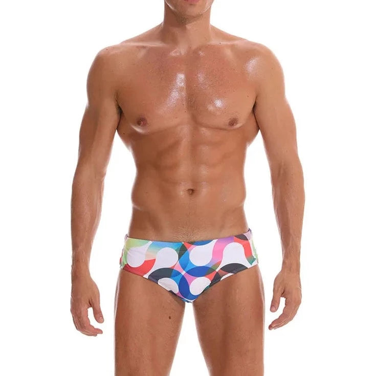 a hot gay man in Men's S-Wave Swim Briefs - pridevoyageshop.com - gay men’s underwear and swimwear