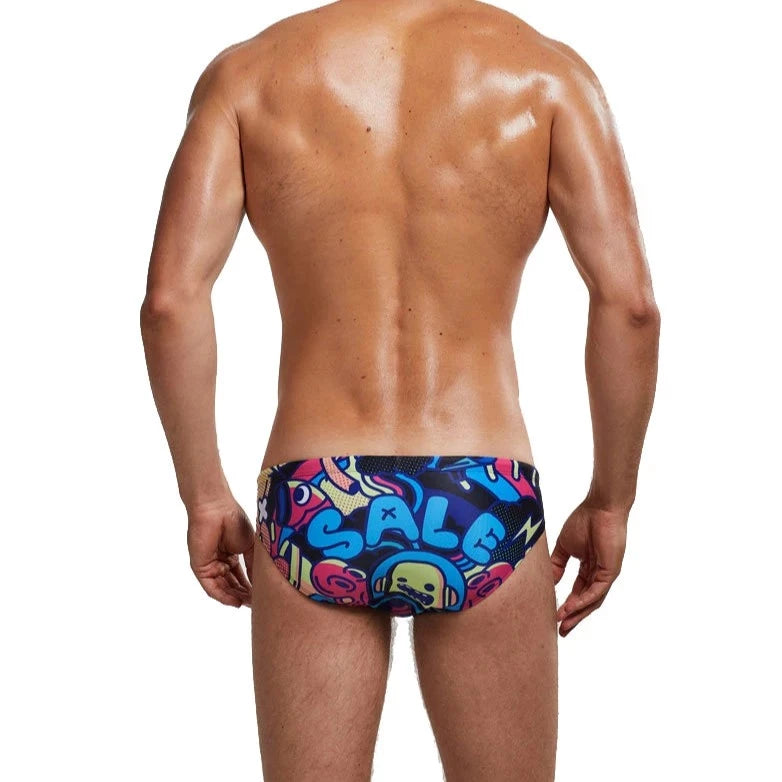 a sexy gay man in Men's Patterned Swim Briefs - pridevoyageshop.com - gay men’s underwear and swimwear