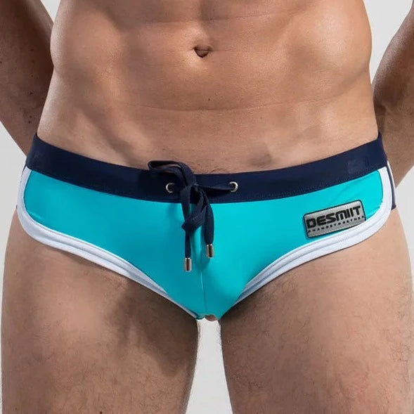 a hot gay man in Light Blue DESMIIT Retro Swim Briefs - pridevoyageshop.com - gay men’s underwear and swimwear