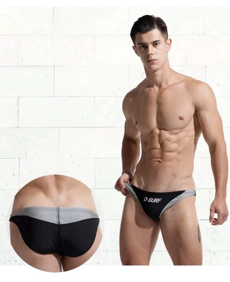 a sexy gay man in black DESMIIT Men's D-Surf Swim Briefs - pridevoyageshop.com - gay men’s underwear and swimwear