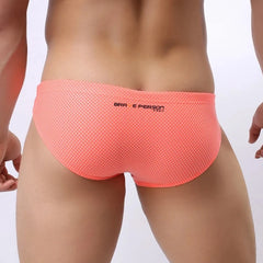 a hot gay man in Orange Brave Person Men's Breathable Mesh Briefs - pridevoyageshop.com - gay men’s underwear and swimwear