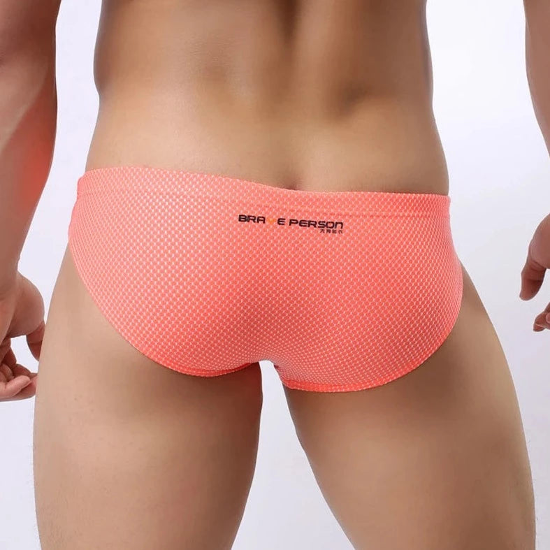 a hot gay man in Orange Brave Person Men's Breathable Mesh Briefs - pridevoyageshop.com - gay men’s underwear and swimwear