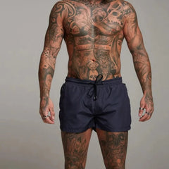 a hot gay man in navy Men's Solid Color Pocketed Running Shorts - pridevoyageshop.com - gay men’s underwear and swimwear