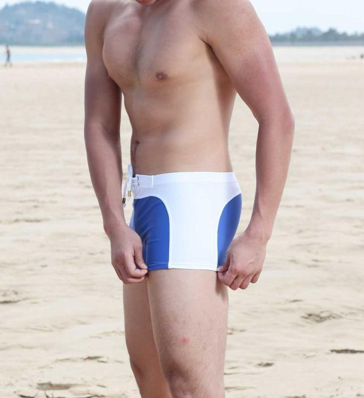 hot gay man in blue and white Gay Swimwear & Beachwear | Quick Dry Aqua Shape Swim Trunks - pridevoyageshop.com - gay men’s underwear and swimwear