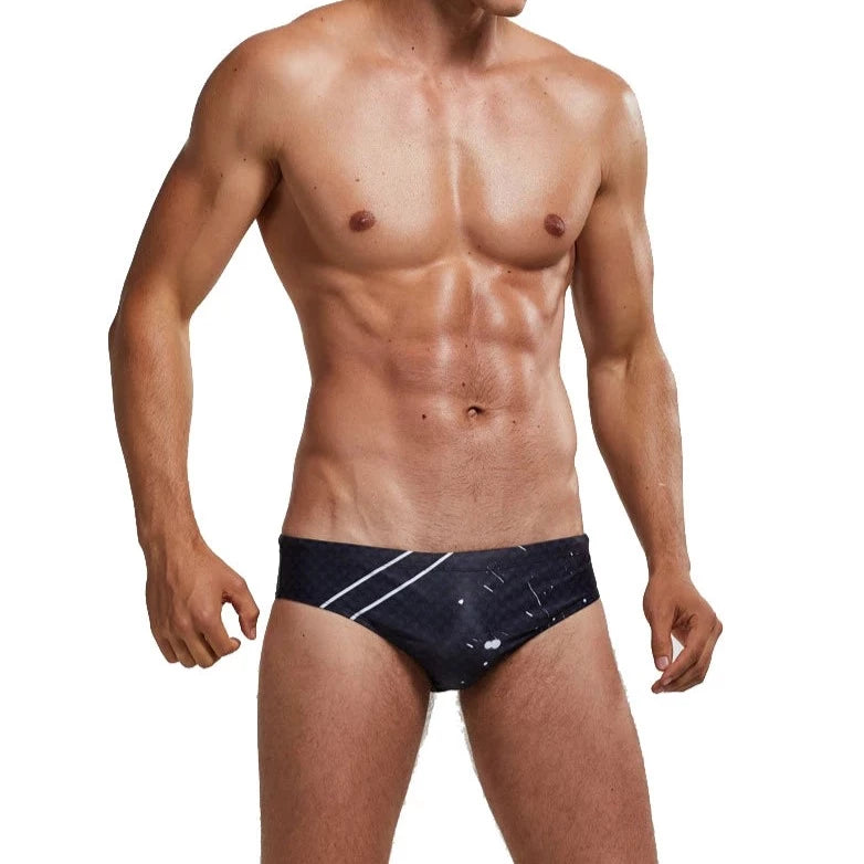 a sexy gay man in Men's Patterned Swim Briefs - pridevoyageshop.com - gay men’s underwear and swimwear