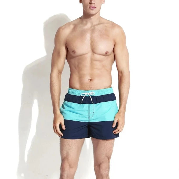 a hot gay dude in turquoise Harbor Hues Board Shorts - pridevoyageshop.com - gay men’s underwear and swimwear