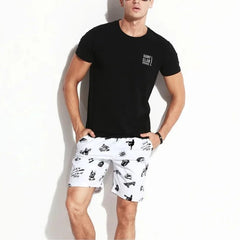 a handsome gay guy in Vacation Doodle Board Shorts - pridevoyageshop.com - gay men’s underwear and swimwear