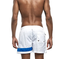 a hot gay man in white Reflex Racer Board Shorts - pridevoyageshop.com - gay men’s underwear and swimwear