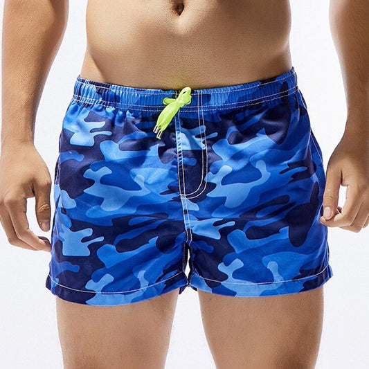 hot gay man in blue Gay Swimwear & Beachwear | Men's Camo Swim Trunks - pridevoyageshop.com - gay men’s underwear and swimwear