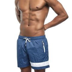 a hot gay man in dark blue Reflex Racer Board Shorts - pridevoyageshop.com - gay men’s underwear and swimwear