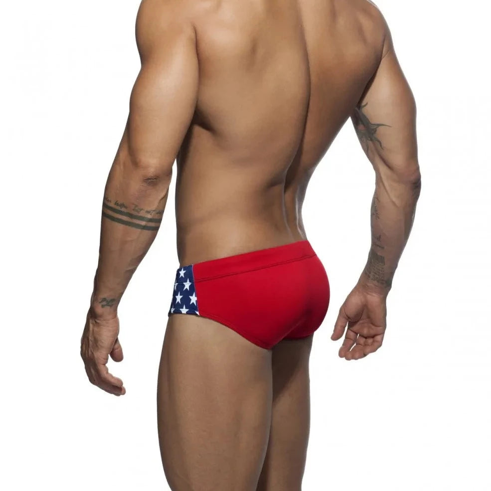 a hot gay man in blue Men's Bowtie Stars Swim Briefs - pridevoyageshop.com - gay men’s underwear and swimwear
