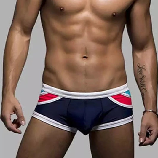 a hot gay man in Men's Spice Colored Swim Trunks - pridevoyageshop.com - gay men’s underwear and swimwear