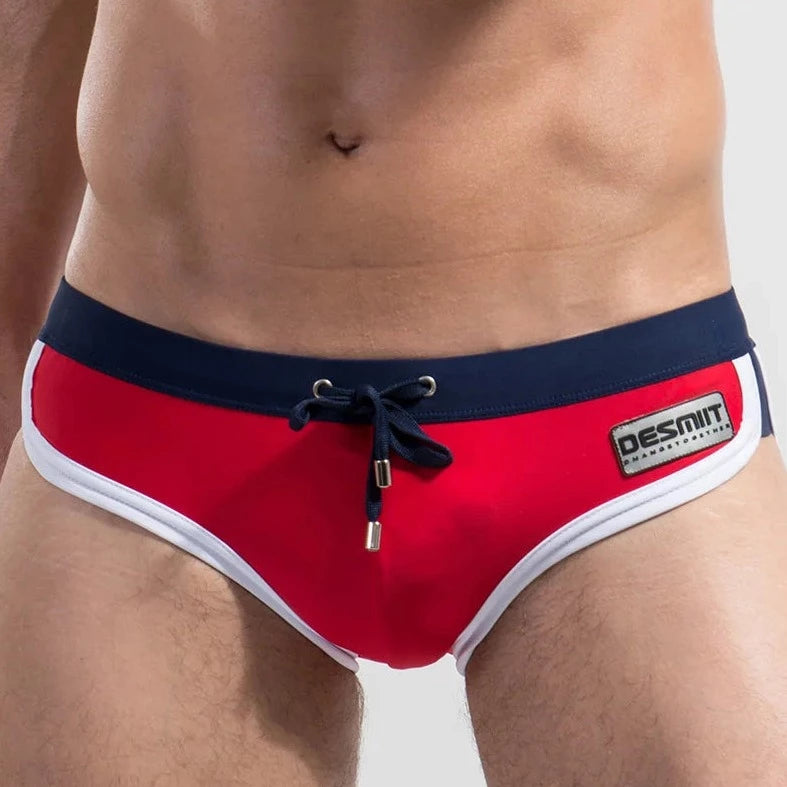 a hot gay man in red DESMIIT Retro Swim Briefs - pridevoyageshop.com - gay men’s underwear and swimwear