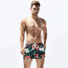 a hot man in dark Petal Play Board Shorts - pridevoyageshop.com - gay men’s underwear and swimwear