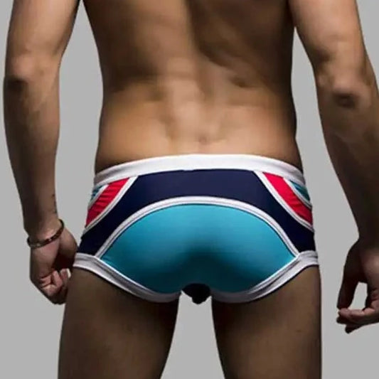 a hot gay man in Men's Spice Colored Swim Trunks - pridevoyageshop.com - gay men’s underwear and swimwear