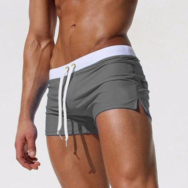 hot gay man in dark gray Gay Swimwear & Beachwear | Men's Square Cut Swim Trunks- pridevoyageshop.com - gay men’s underwear and swimwear