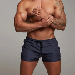 a hot gay man in navy Men's Solid Color Pocketed Running Shorts - pridevoyageshop.com - gay men’s underwear and swimwear