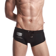 a sexy gay man in black Men's Athletic Square Cut Swim Trunks - pridevoyageshop.com - gay men’s underwear and swimwear