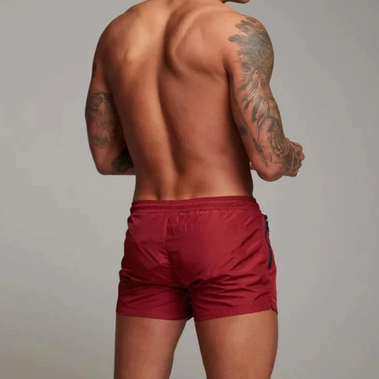  a hot gay man in red Men's Solid Color Pocketed Running Shorts - pridevoyageshop.com - gay men’s underwear and swimwear