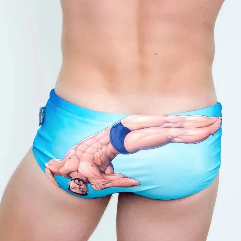 a sexy gay man in Blue Diver Muscle Swim Briefs - pridevoyageshop.com - gay men’s underwear and swimwear