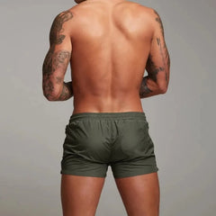 a hot gay man in army green Men's Solid Color Pocketed Running Shorts - pridevoyageshop.com - gay men’s underwear and swimwear