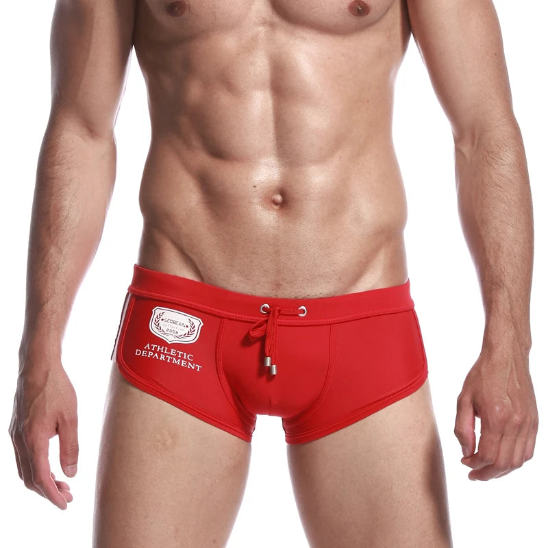 a sexy gay man in red Men's Athletic Square Cut Swim Trunks - pridevoyageshop.com - gay men’s underwear and swimwear