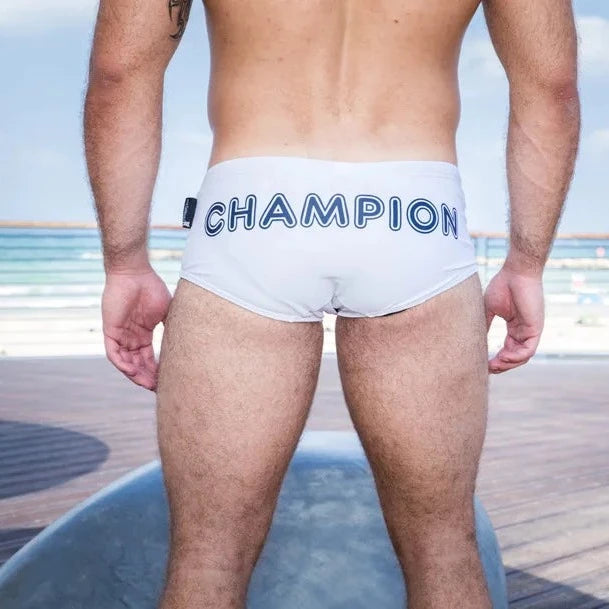 a hot daddy in Muscle Daddy Champion Swim Briefs - pridevoyageshop.com - gay men’s underwear and swimwear