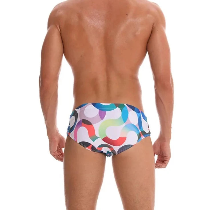 a hot gay man in Men's S-Wave Swim Briefs - pridevoyageshop.com - gay men’s underwear and swimwear