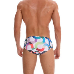 a hot gay man in Men's S-Wave Swim Briefs - pridevoyageshop.com - gay men’s underwear and swimwear