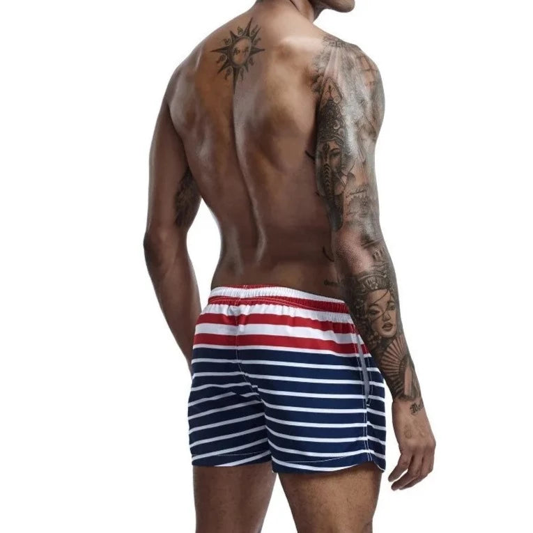 a hot gay man in Men's Sailor Striped Board Shorts - pridevoyageshop.com - gay men’s underwear and swimwear