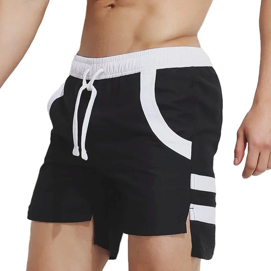 a hot man in black Beachfront Bold Board Shorts - pridevoyageshop.com - gay men’s underwear and swimwear