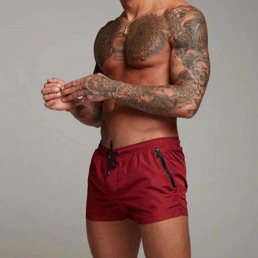 a hot gay man in red Men's Solid Color Pocketed Running Shorts - pridevoyageshop.com - gay men’s underwear and swimwear