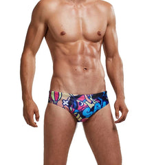 a sexy gay man in Men's Patterned Swim Briefs - pridevoyageshop.com - gay men’s underwear and swimwear