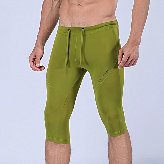sexy gay man in light green Gay Leggings | Men's Sexy 3/4 Compression Sport Leggings - pridevoyageshop.com - gay men’s underwear and activewear