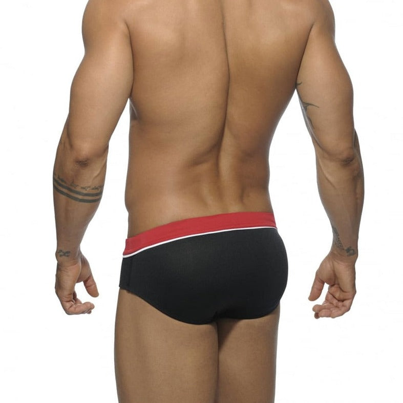 sexy gay man in black Gay Swimwear | Side Stripe Swim Briefs- pridevoyageshop.com - gay men’s underwear and swimwear