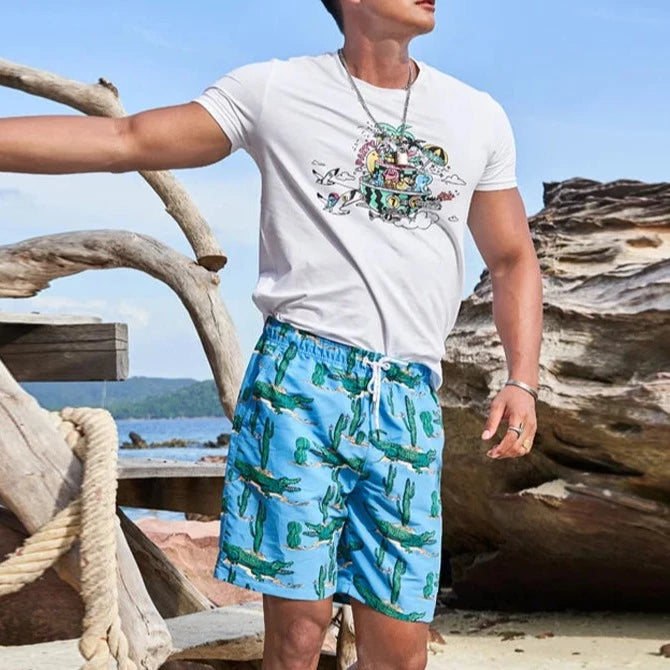 a handsome guy in blue Mexican Desert Croc Board Shorts - pridevoyageshop.com - gay men’s underwear and swimwear