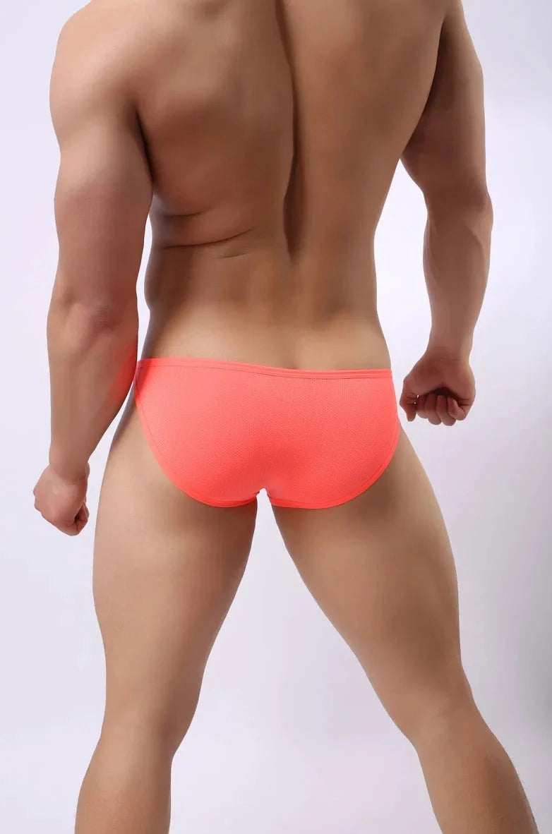 a hot gay man in Orange Brave Person Side Buckle Briefs - pridevoyageshop.com - gay men’s underwear and swimwear