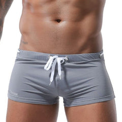 hot gay man in gray Gay Swimwear & Beachwear | Men's Bowtie Tight Swim Trunks - pridevoyageshop.com - gay men’s underwear and swimwear