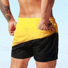 a hot guy in yellow Tidal Charm Two Toned Board Shorts - pridevoyageshop.com - gay men’s underwear and swimwear