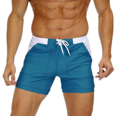 hot gay man in Peacock Blue Gay Swimwear & Beachwear | Drawstring Boxer Swim Trunks - pridevoyageshop.com - gay men’s underwear and swimwear