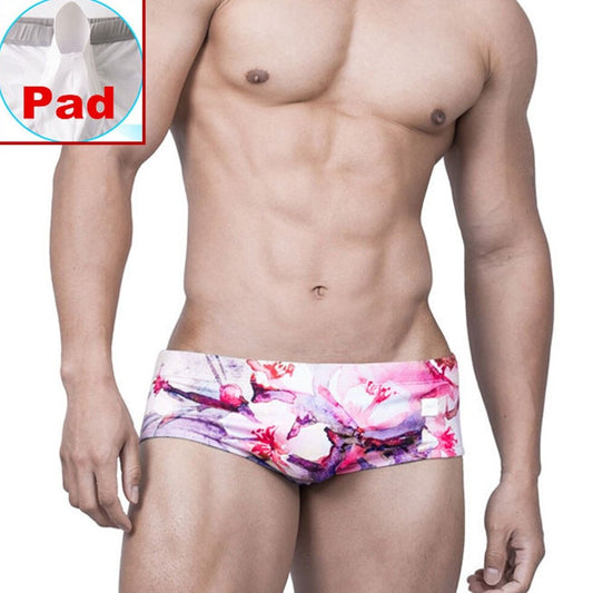 sexy gay man in Gay Swimwear | Pink Watercolor Swim Briefs- pridevoyageshop.com - gay men’s underwear and swimwear