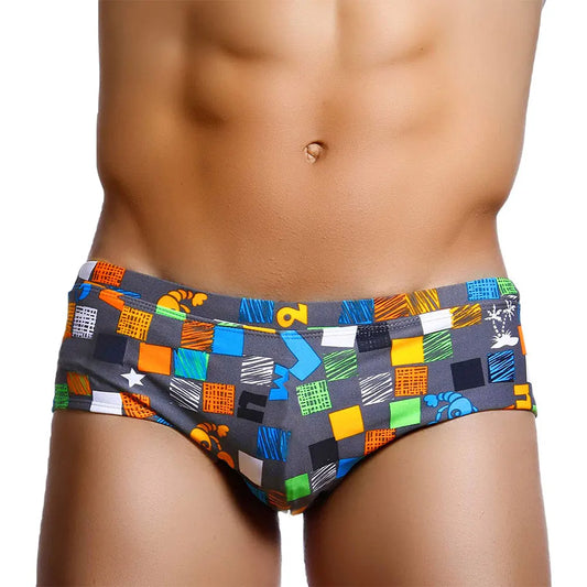 a hot gay man in Ocean Mosaic Swim Trunks - pridevoyageshop.com - gay men’s underwear and swimwear