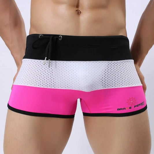 a hot gay man in Black + White + Pink Men's Tricolor Mesh Swim Trunks - pridevoyageshop.com - gay men’s underwear and swimwear